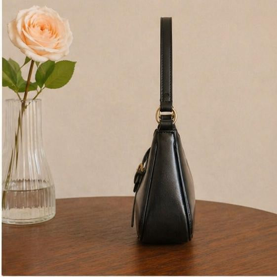 Sleek black Handbag with Gold Buckle