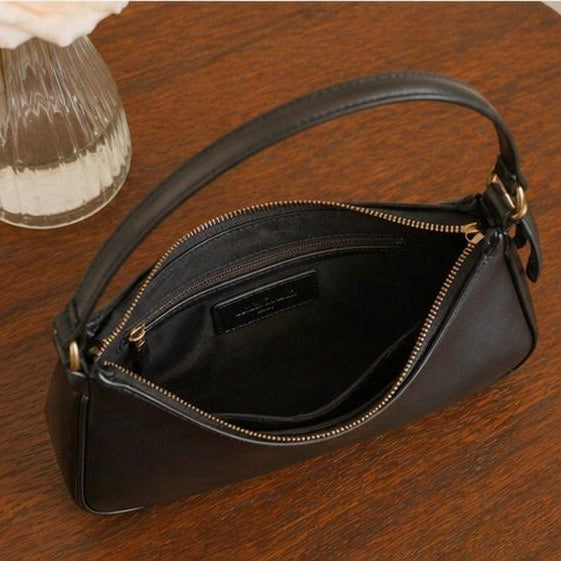 Sleek black Handbag with Gold Buckle